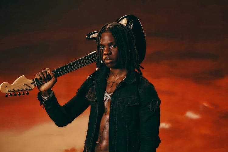 Rema performing live on stage 2025